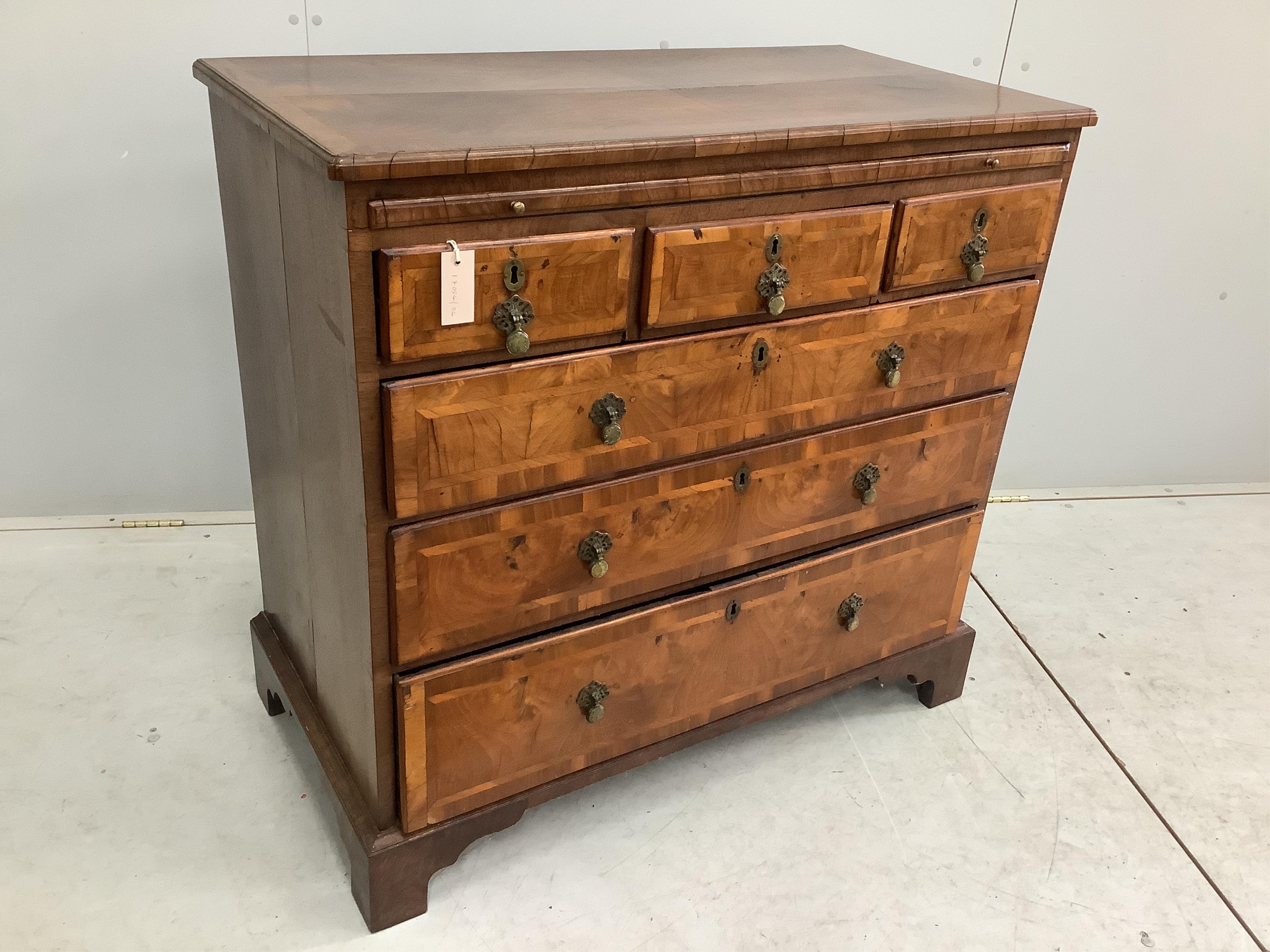 A George II walnut and isometric banded chest of drawers, width 99cm, depth 51cm, height 94cm. Condition - fair